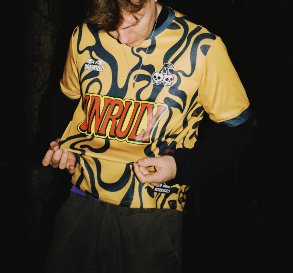 Yellow and Green streetwear jersey, unique design, loose fitting, UNRULY DRKWRLD themed soccer jersey football shirt